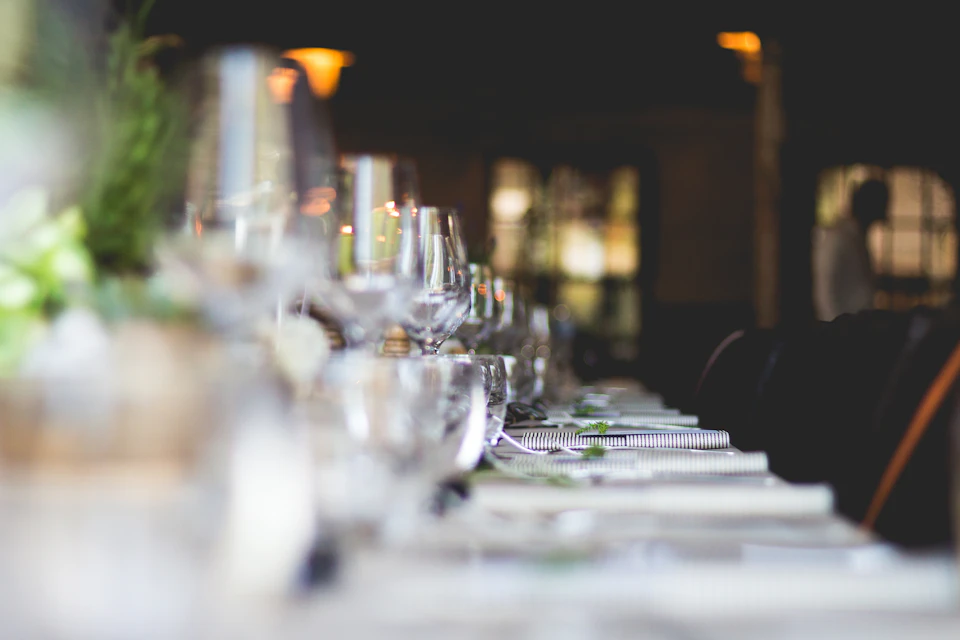 Set table with crystal glassware in warm light